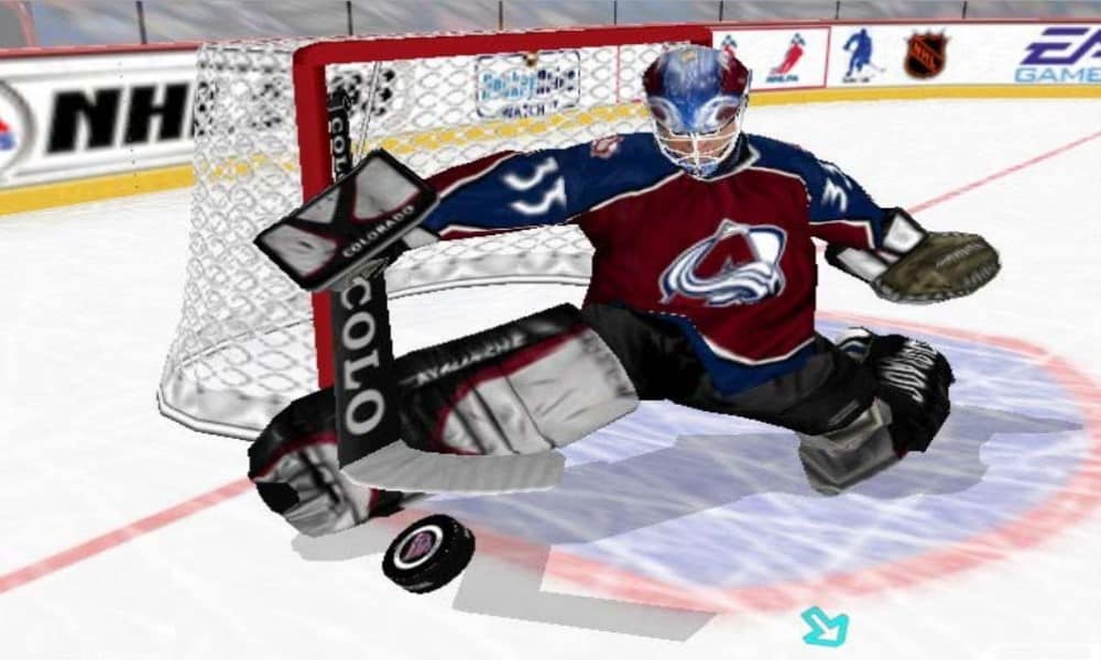 Virtual Patrick Roy making a kick save in front of the net - Image from NHL Hitz 20-03 for the Xbox