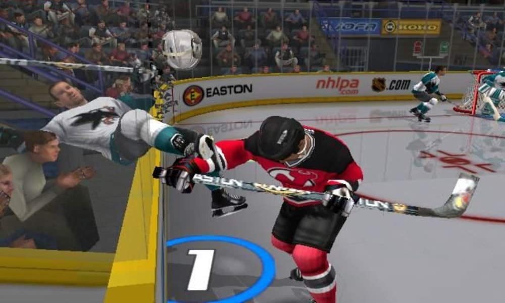Virtual Scott Stevens body checking an opposing skater over the boards - Image from NHL Hitz 20-02 for the Xbox