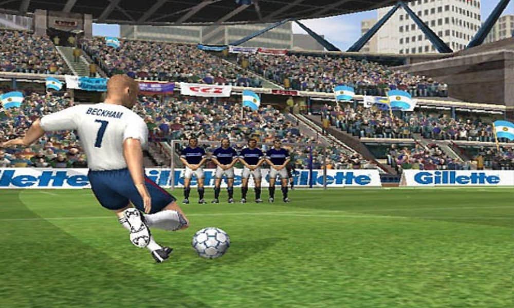 Virtual David Beckham winding up to kick a soccer ball towards the net - Image from David Beckham Soccer for the Xbox